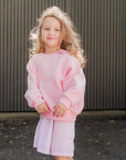 Frankie Jumper in blush pink worn over the dress