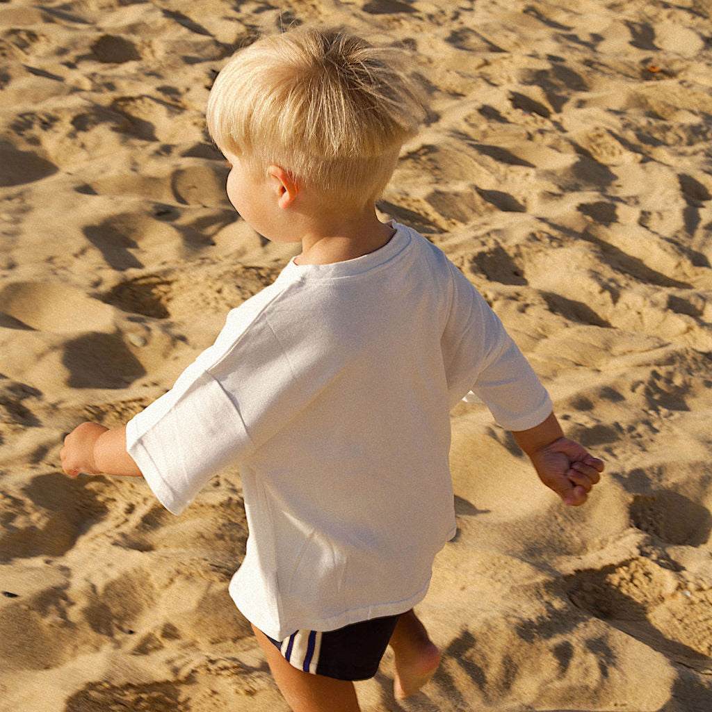 Child playing on a sandy beach